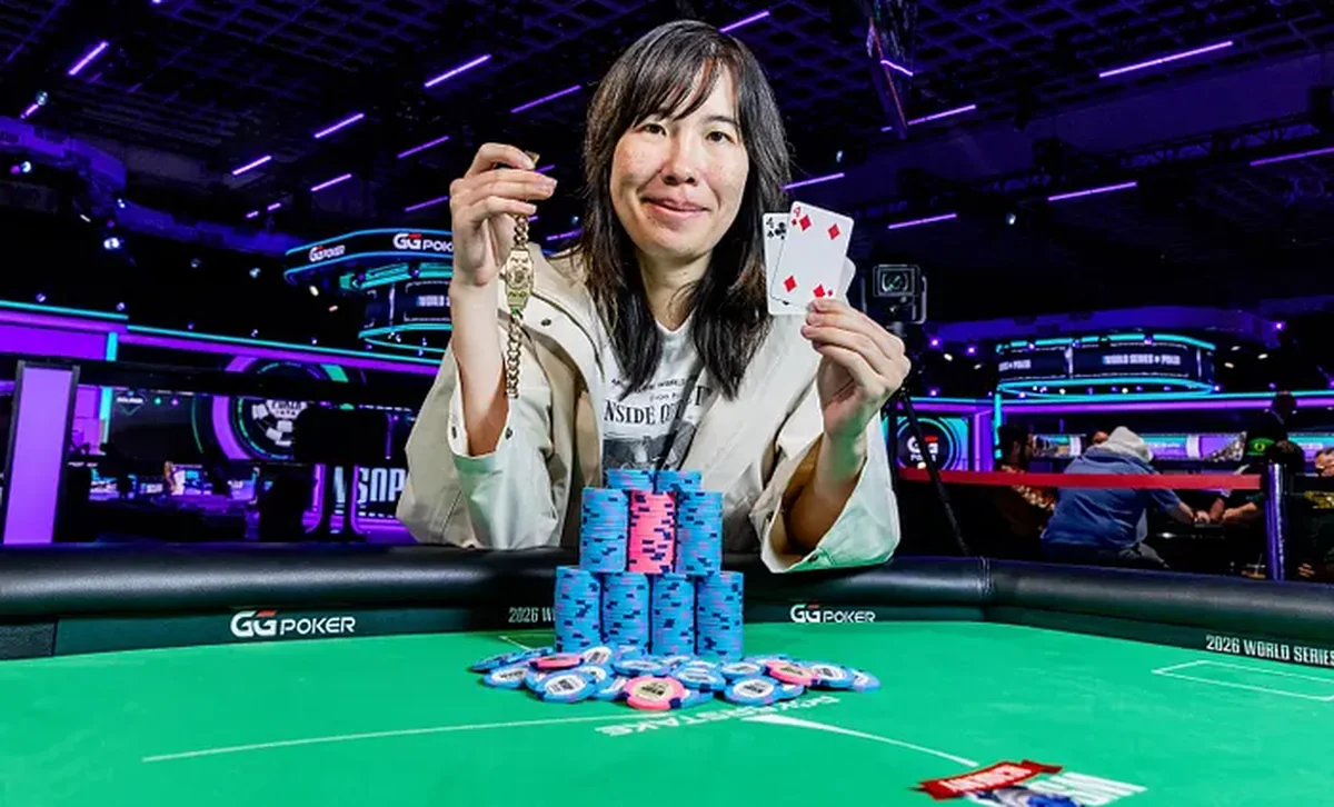 Skye Chen celebrates with the gold winner's watch and her winning hole cards after taking the 2026 WSOP Ladies Championship
